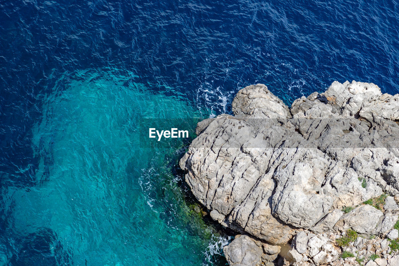 Bay on the peninsula la victoria, mallorca with rock in the water and rocky coastline