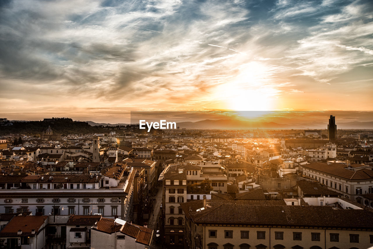 High angle view of city at sunset