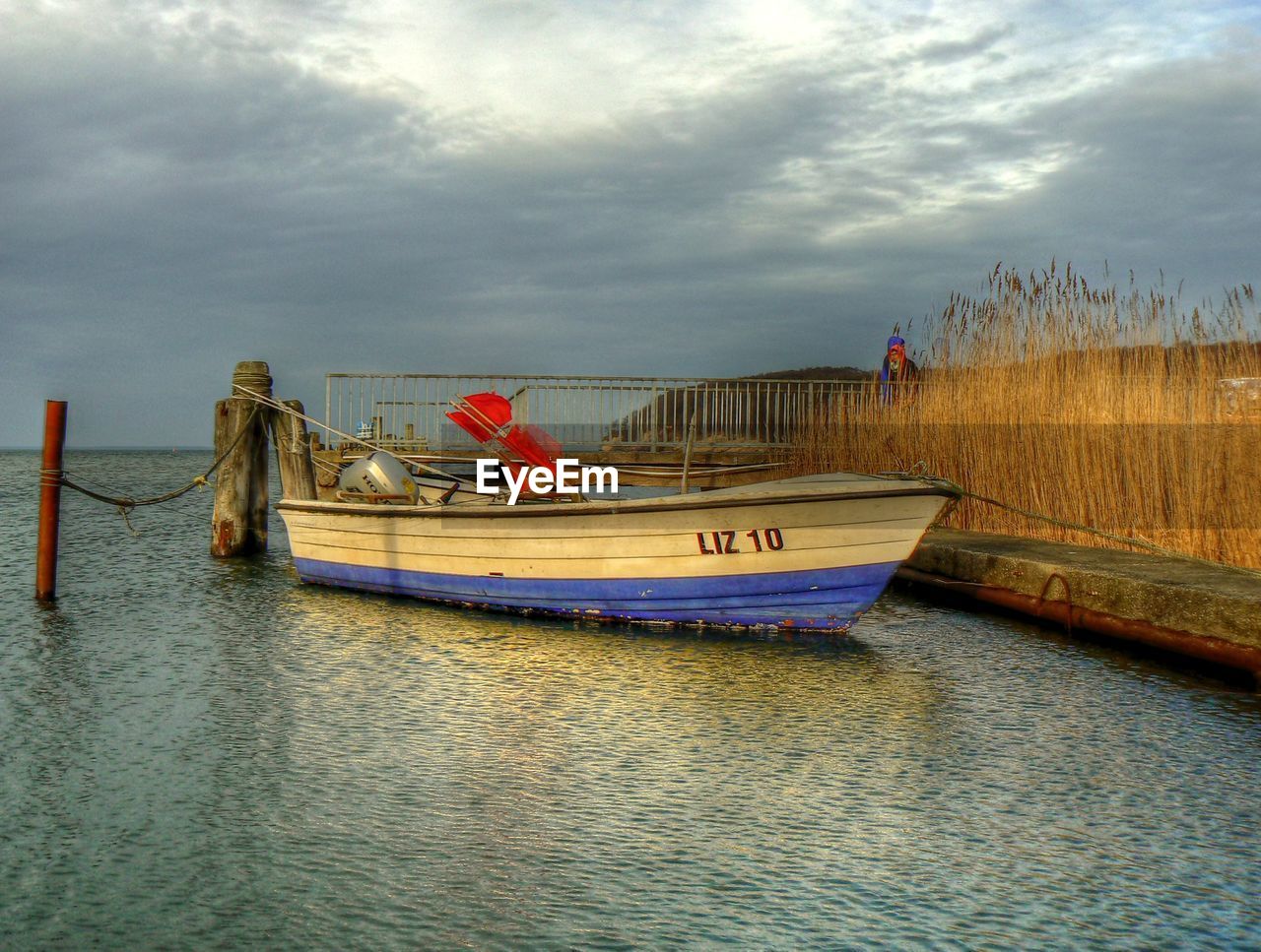 BOATS ON SEA AGAINST CLOUDY SKY