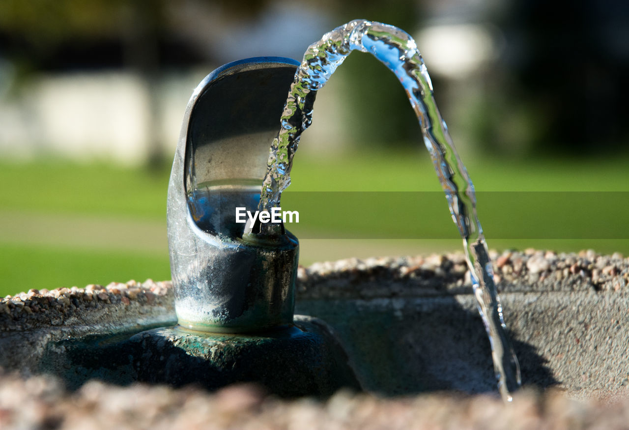 Close-up of water flowing from drinking fountain