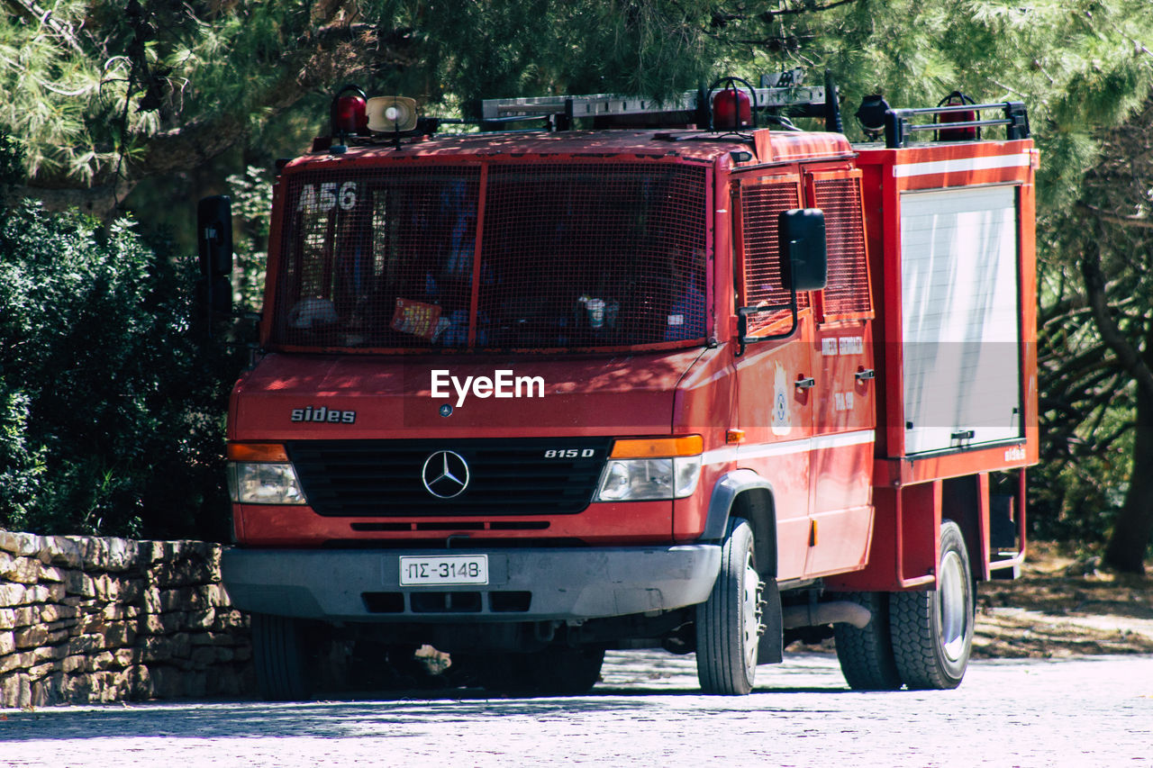 VIEW OF RED TRUCK IN CITY