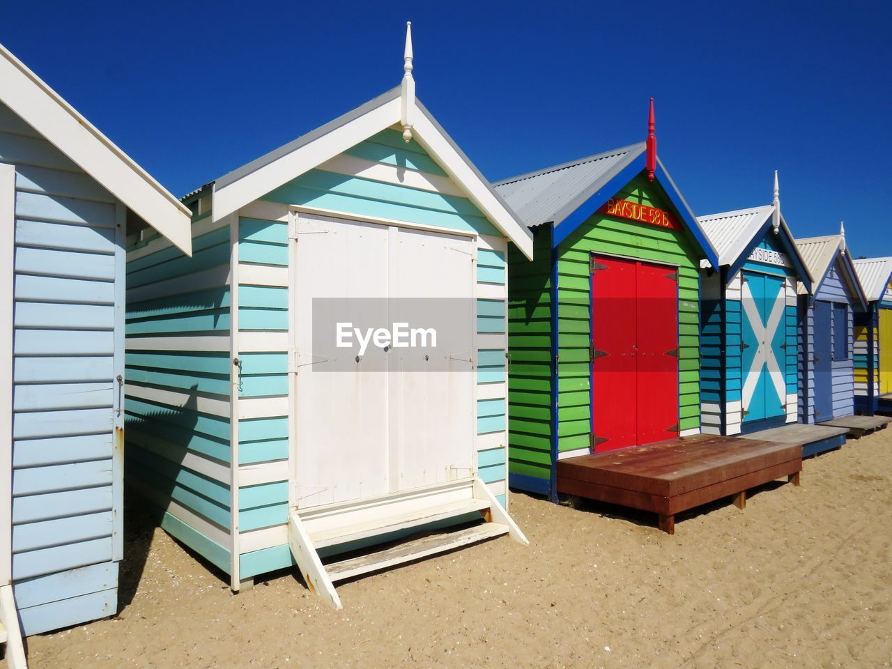 Beach huts against blue sky. brighton beach bathing boxes, victoria.