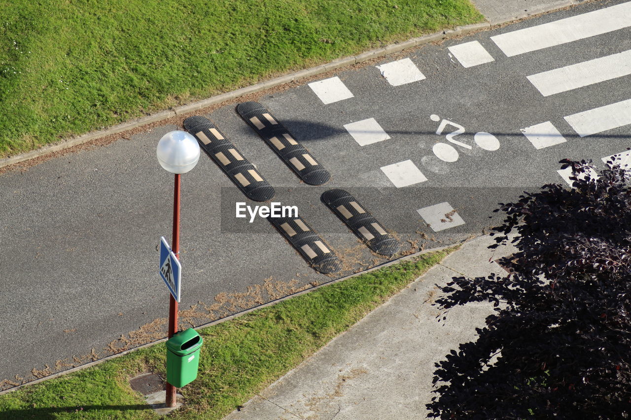 High angle view of arrow sign on road