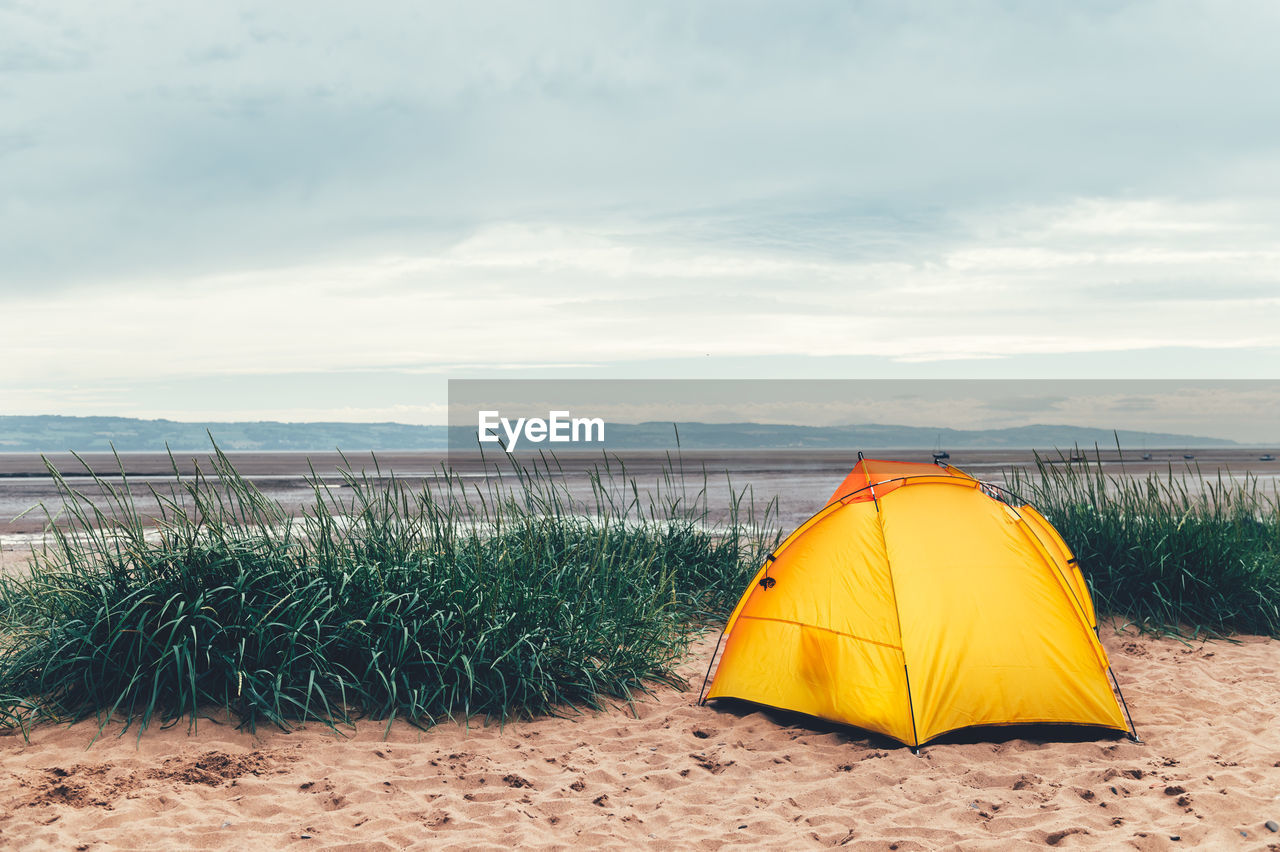 YELLOW TENT ON BEACH