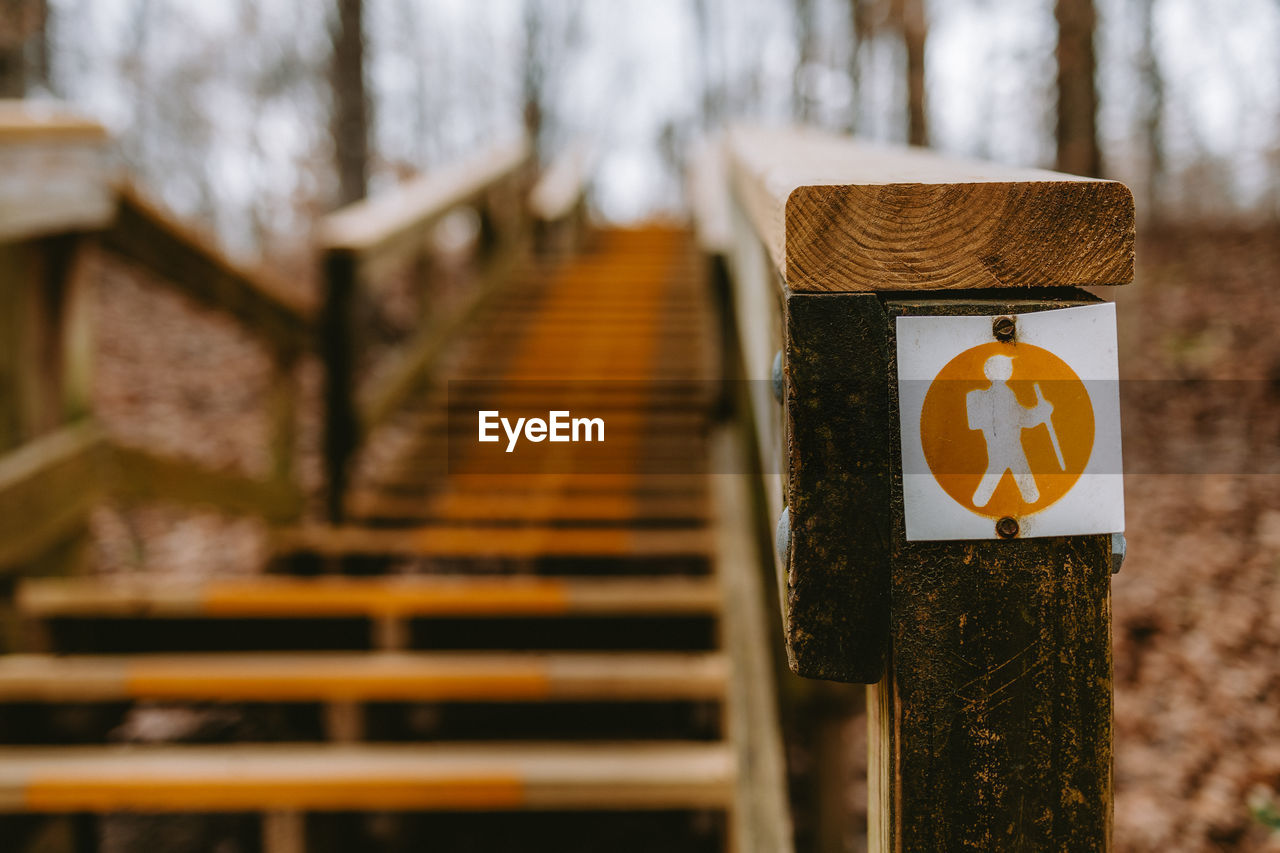 low angle view of people walking on railing