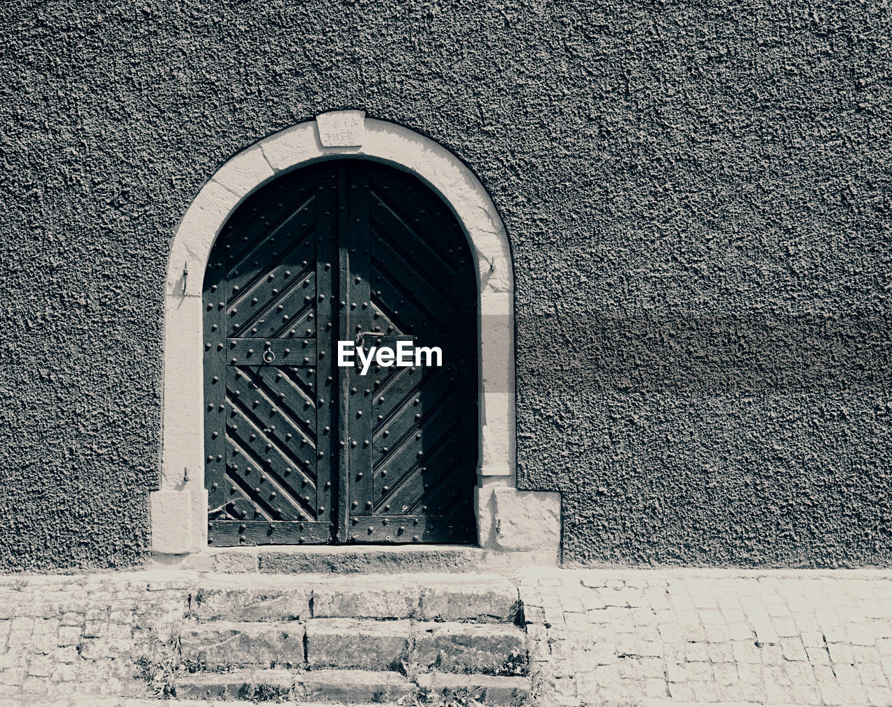WINDOW ON OLD BUILDING