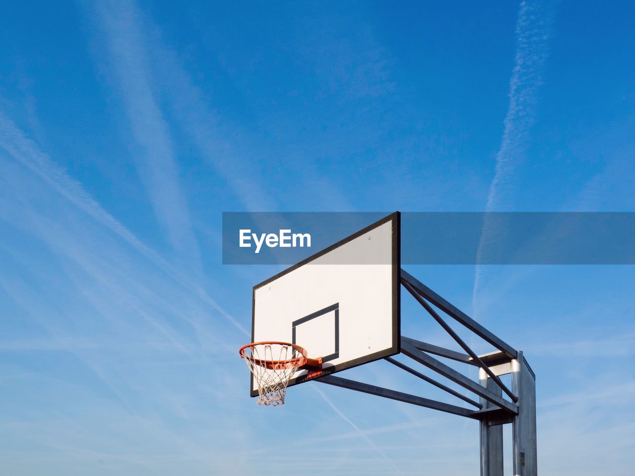 Low angle view of basketball hoop against wall