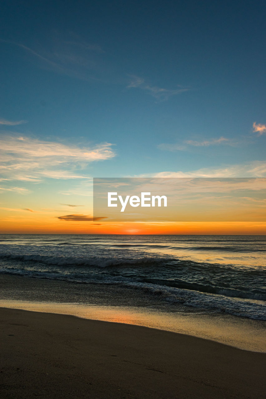 Scenic view of sea against sky during sunset