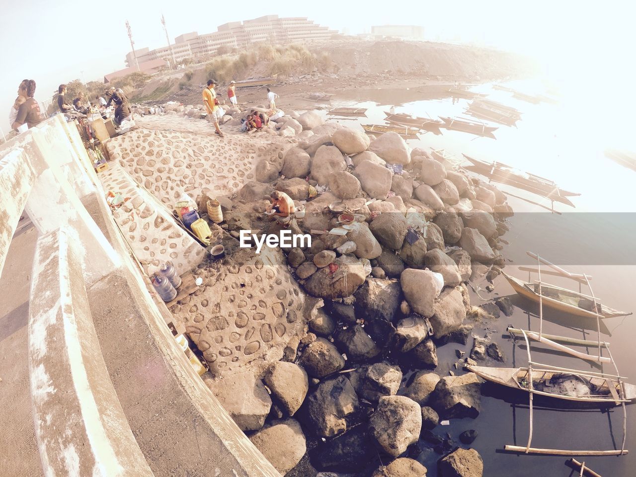 Fish-eye view of people at riverbank