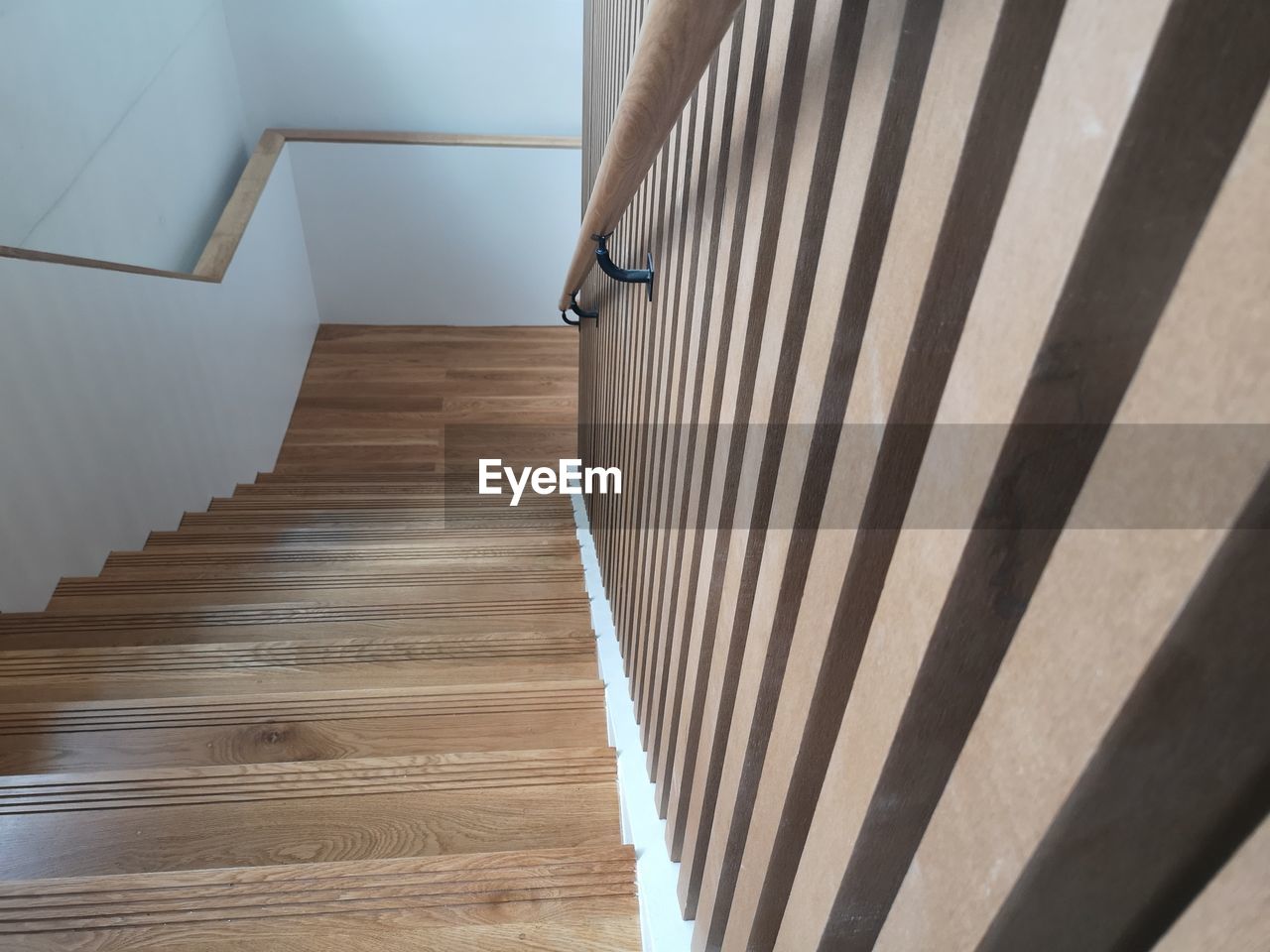 HIGH ANGLE VIEW OF STAIRCASE AT HOME