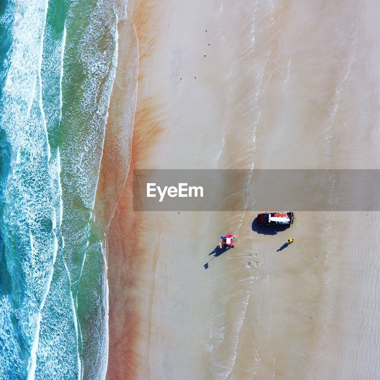 Aerial view of pick-up truck at beach on sunny day