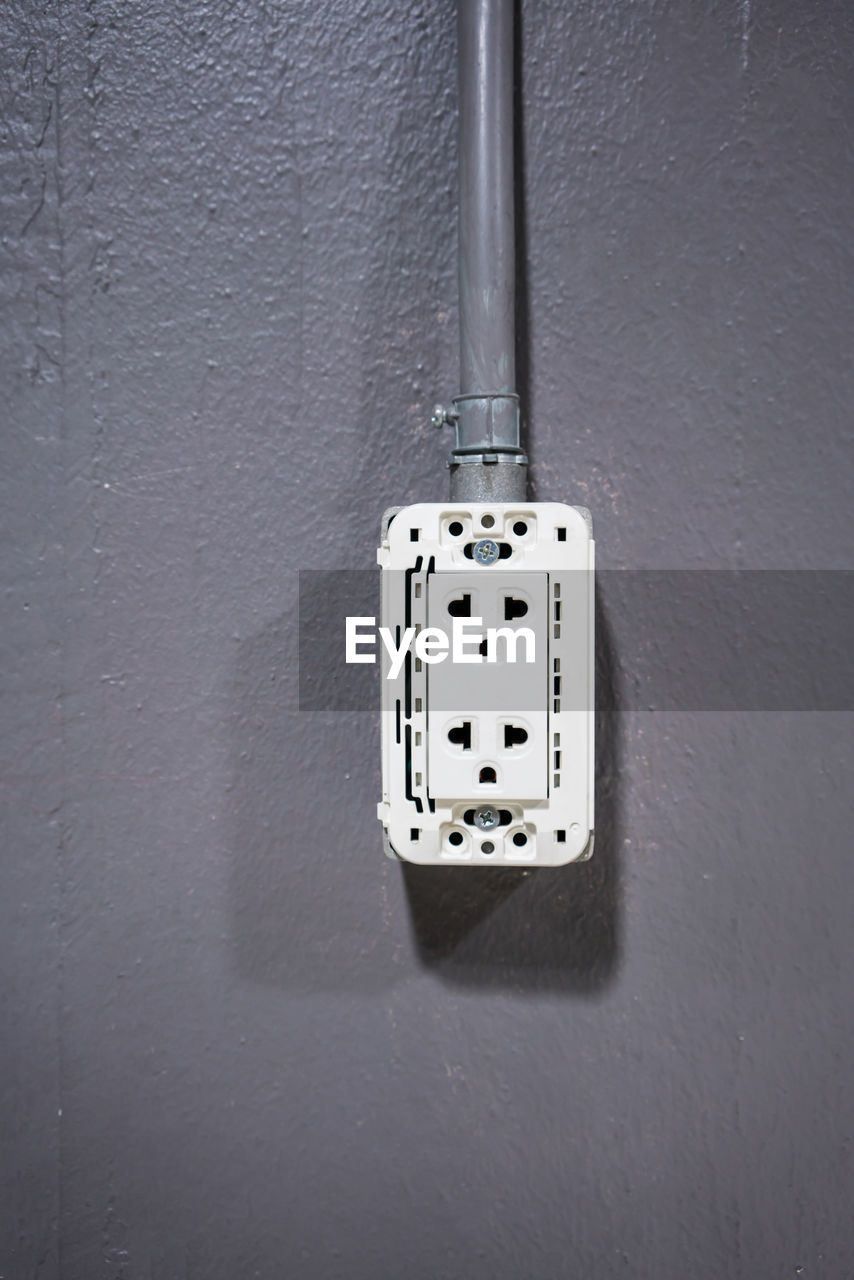 Close-up of switch on wall