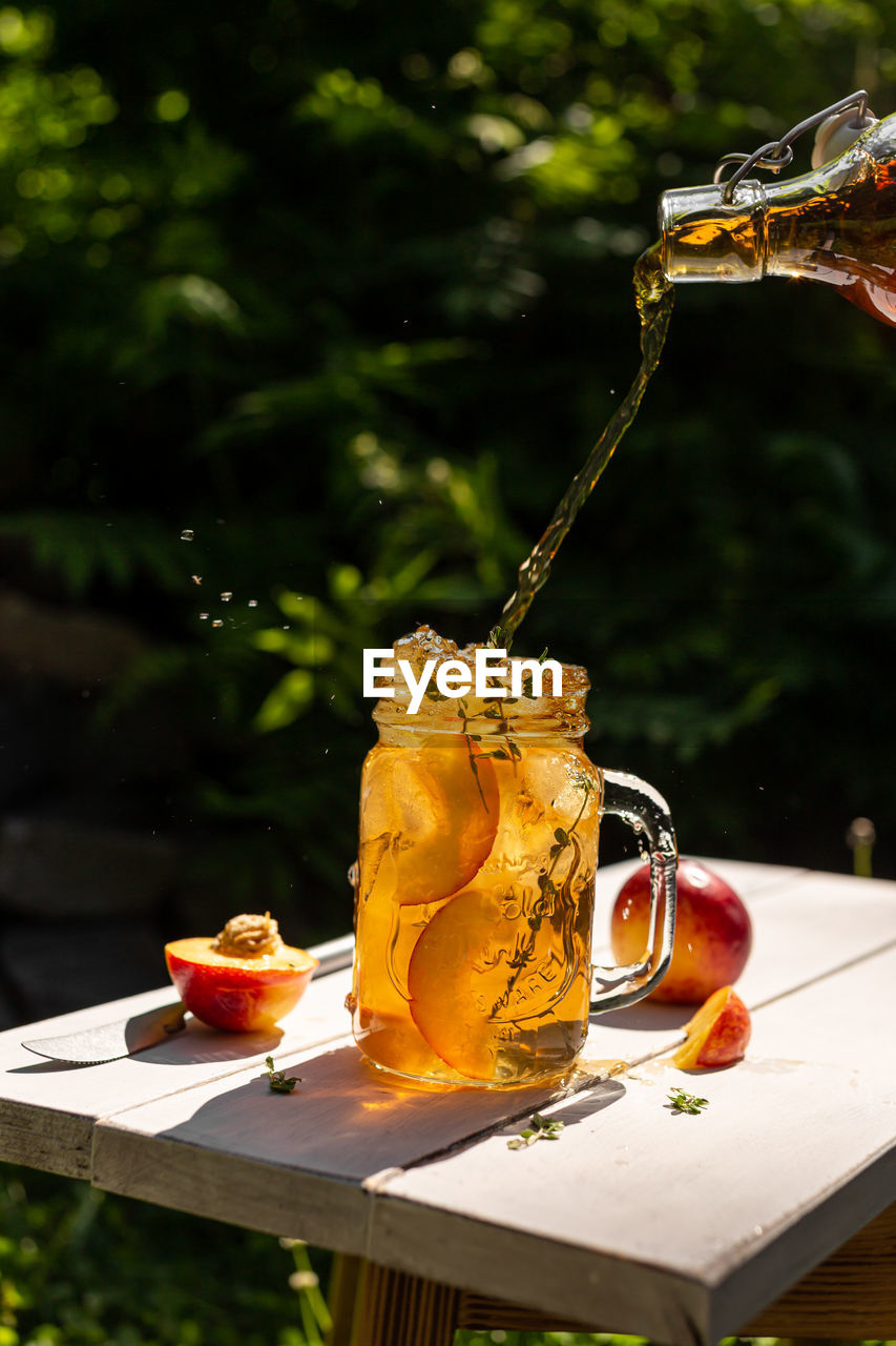 Iced tea with peaches in a glass