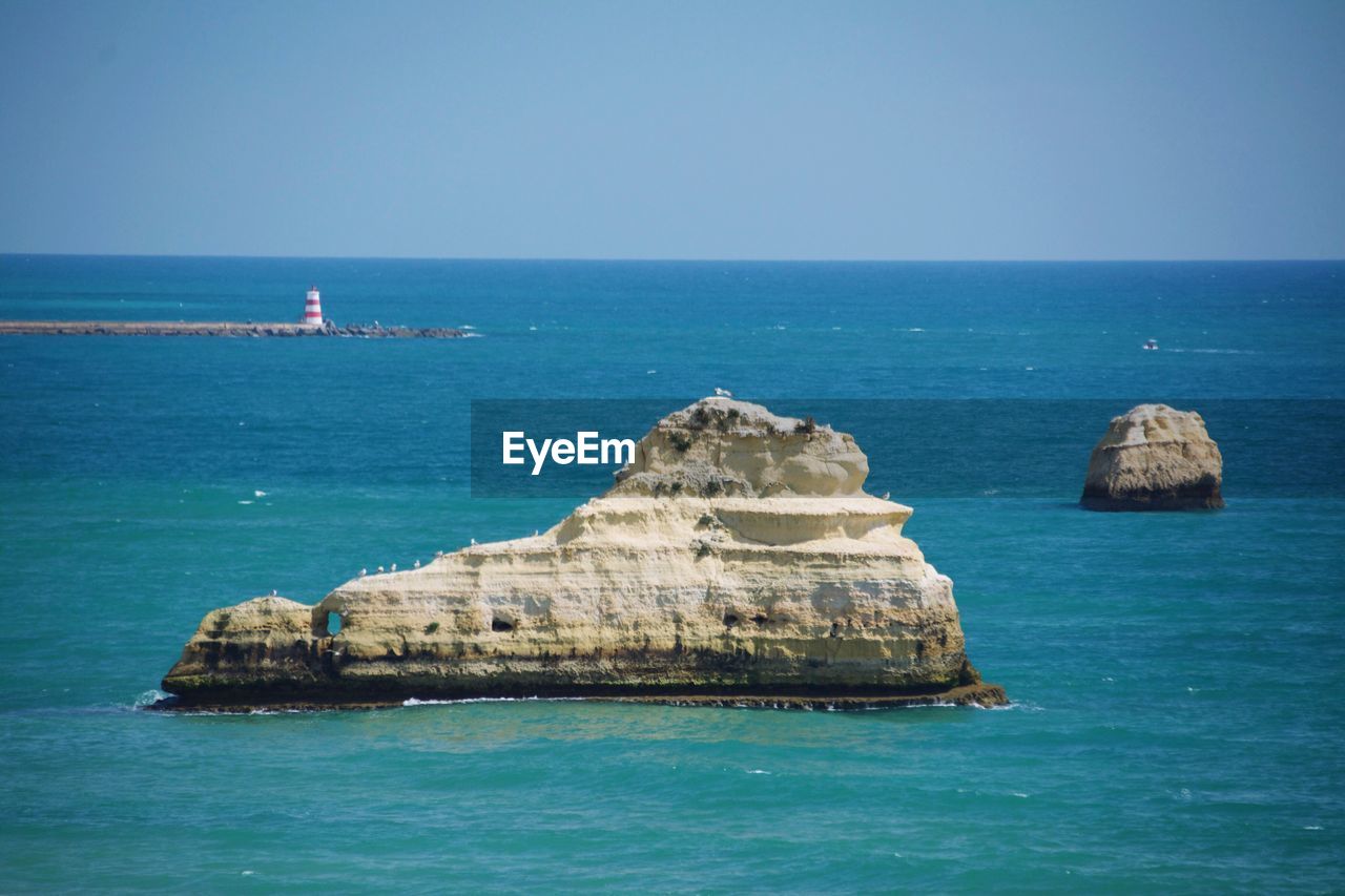 Scenic view of sea against clear sky