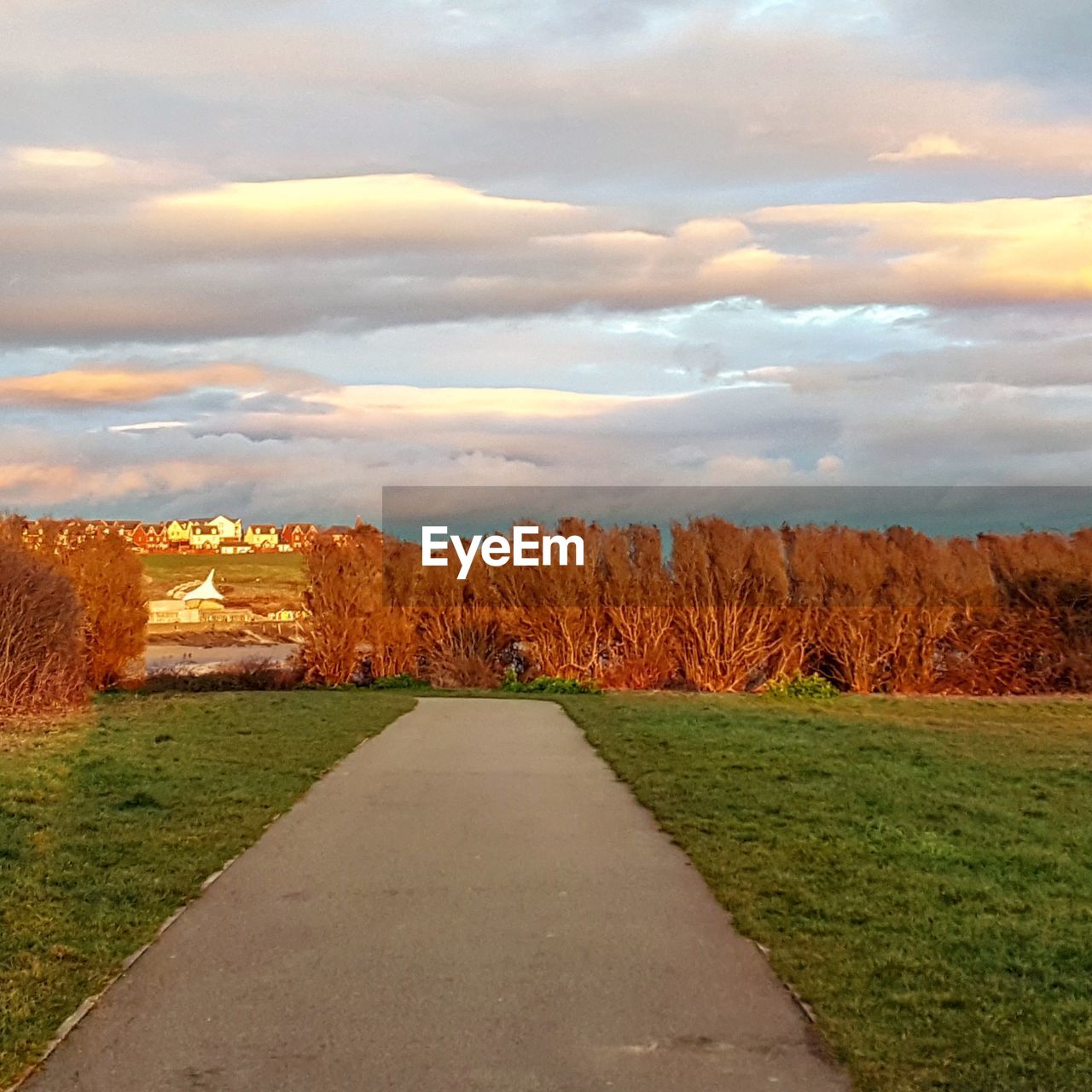 ROAD PASSING THROUGH RURAL LANDSCAPE