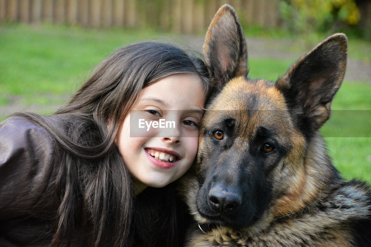 Portrait of cute girl with dog