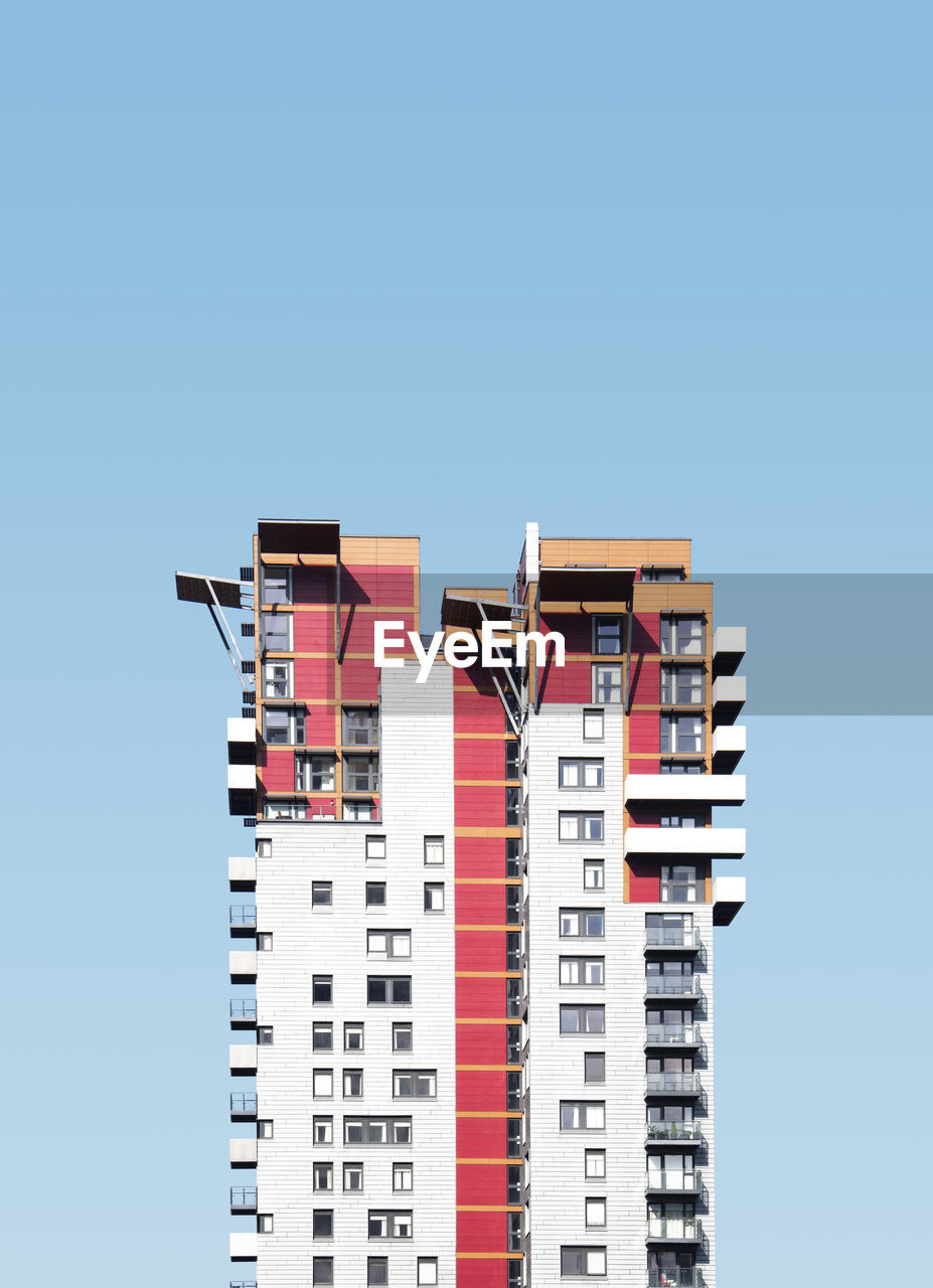 Low angle view of building against clear blue sky