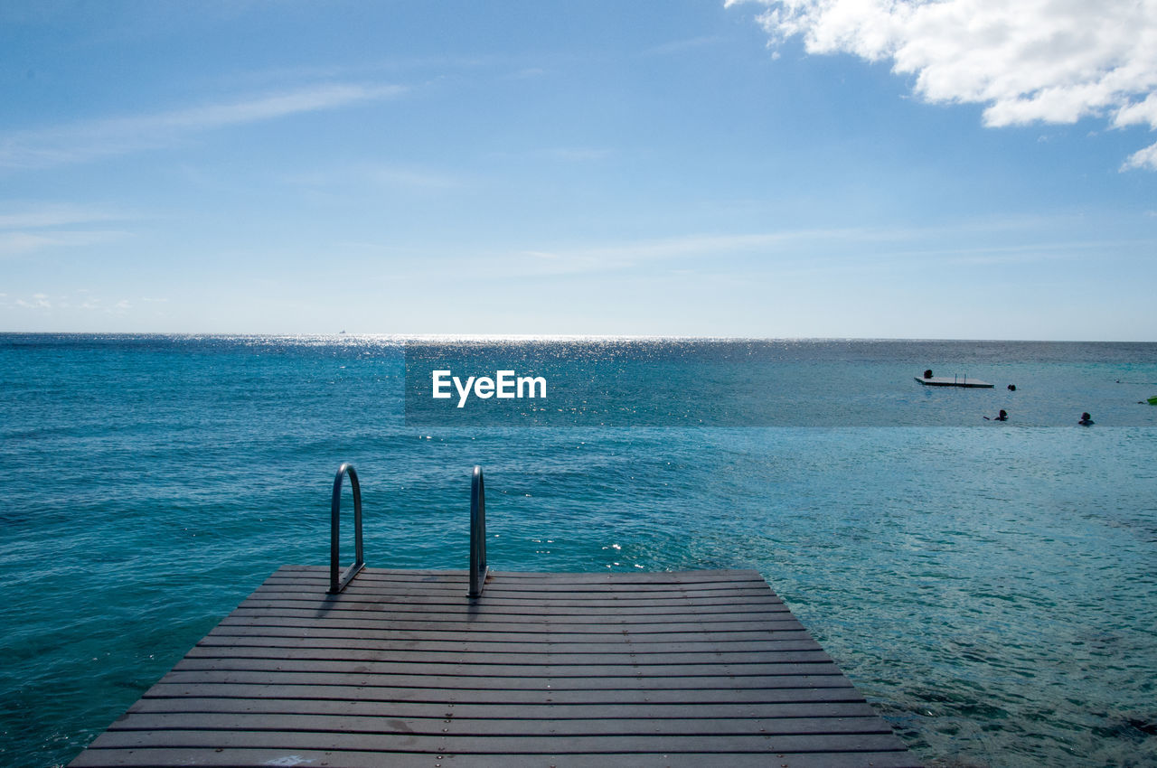 water, horizon, sea, sky, ocean, shore, horizon over water, scenics - nature, beauty in nature, nature, vacation, tranquility, tranquil scene, blue, coast, body of water, cloud, day, bay, pier, wood, beach, wave, idyllic, no people, land, outdoors, jetty, non-urban scene, nautical vessel, sunlight, travel, the way forward, seascape, travel destinations, holiday, transportation, trip