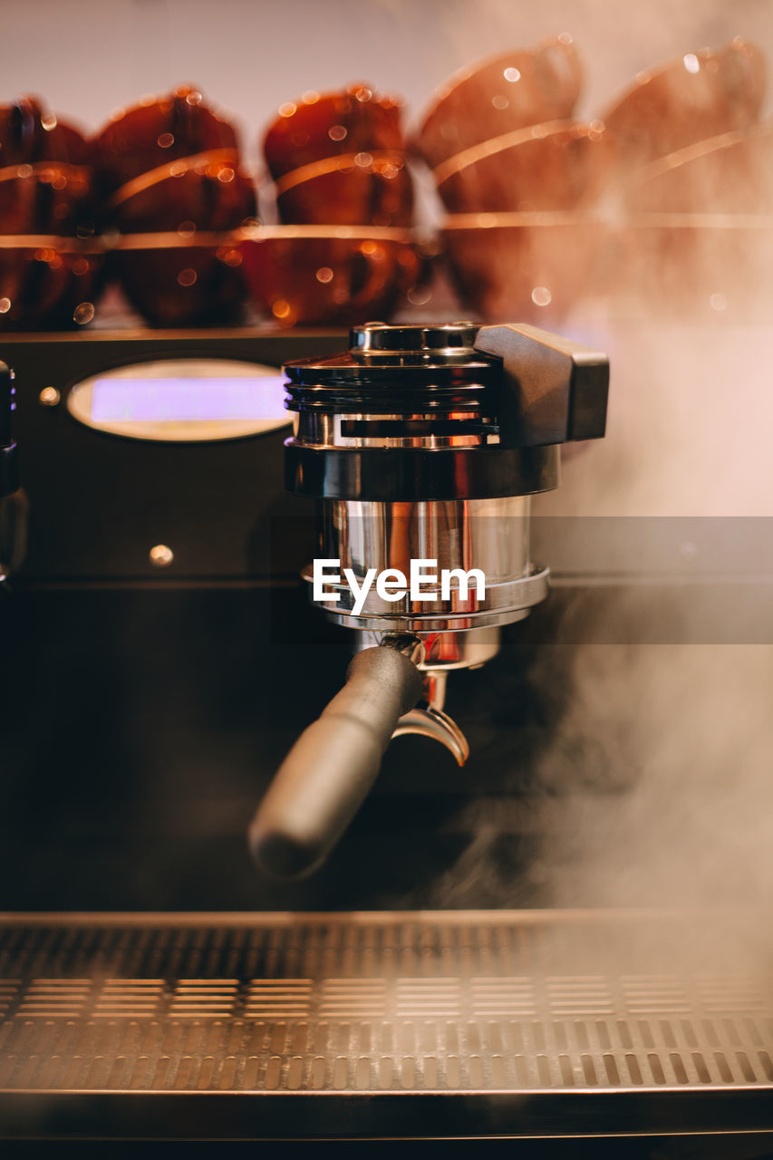 Close-up of steam emitting from espresso maker