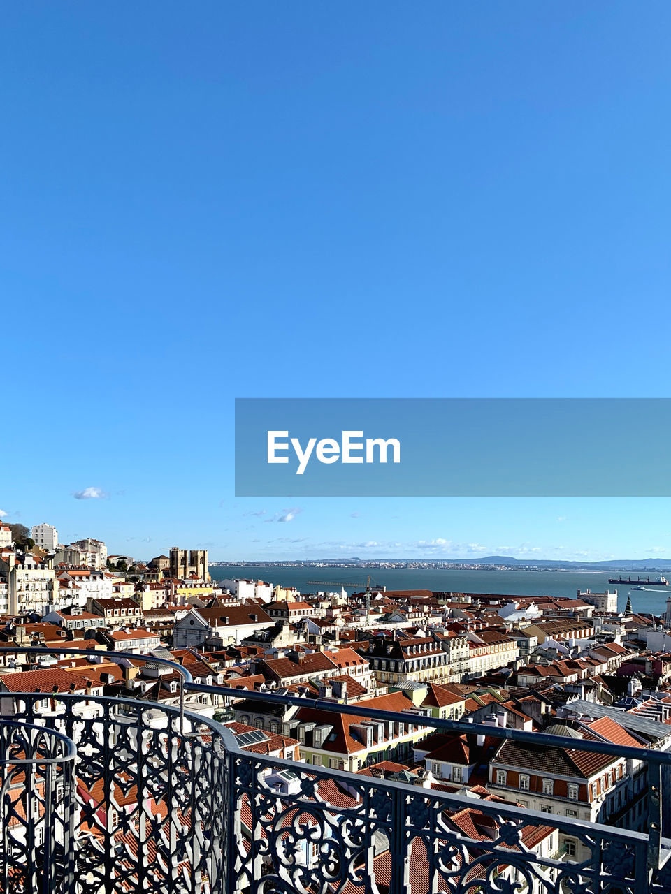 High angle shot of townscape against blue sky