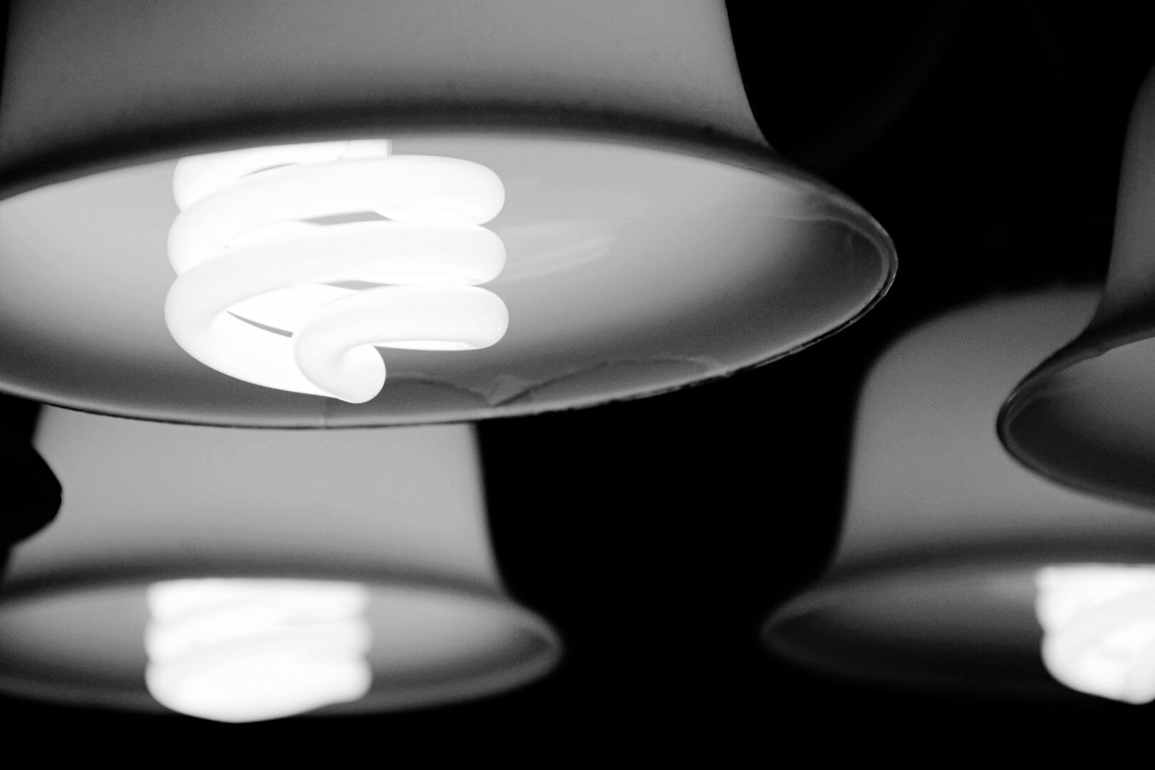 Close-up of illuminated pendant lights at home