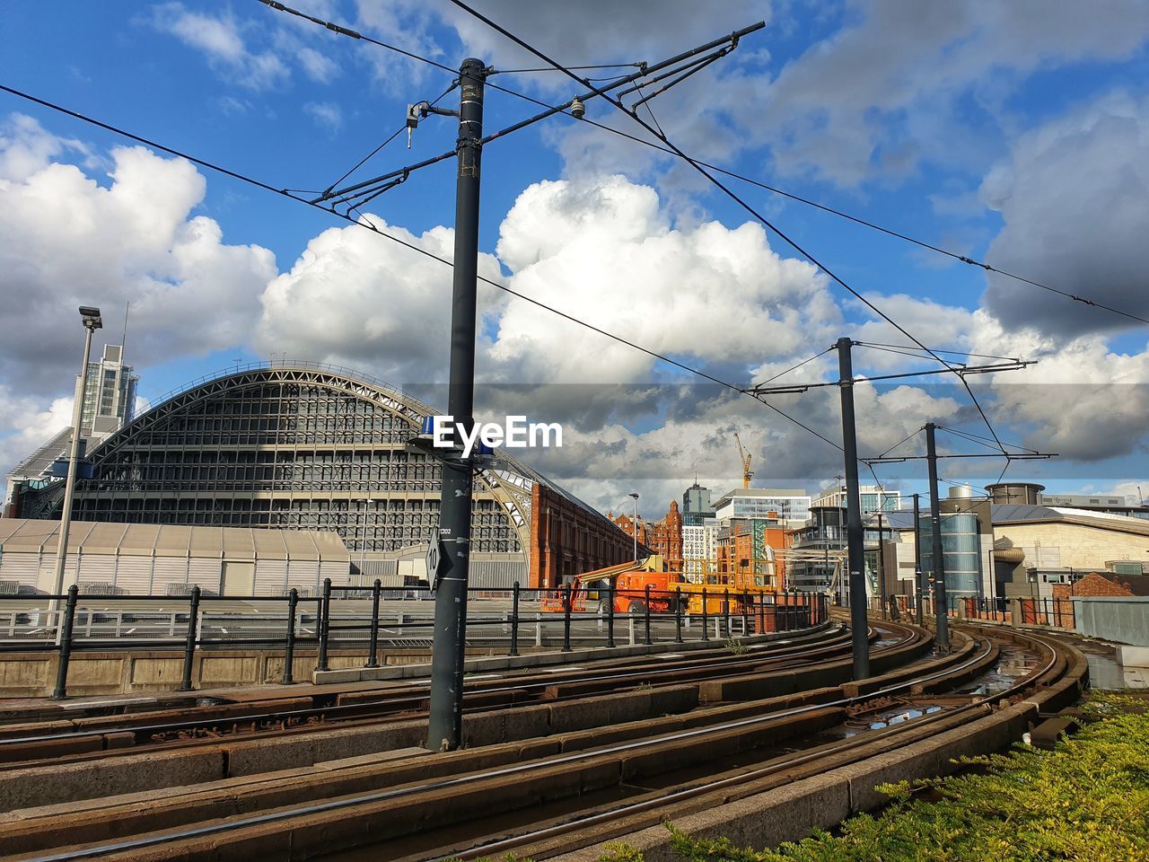 Tram railroad tracks against sky at deansgate castlefield manchester tram station