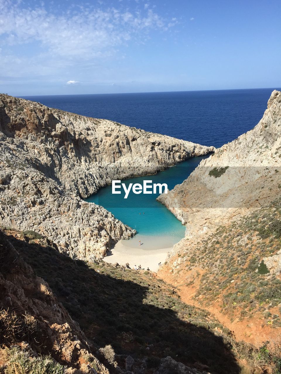 Scenic view of sea against blue sky