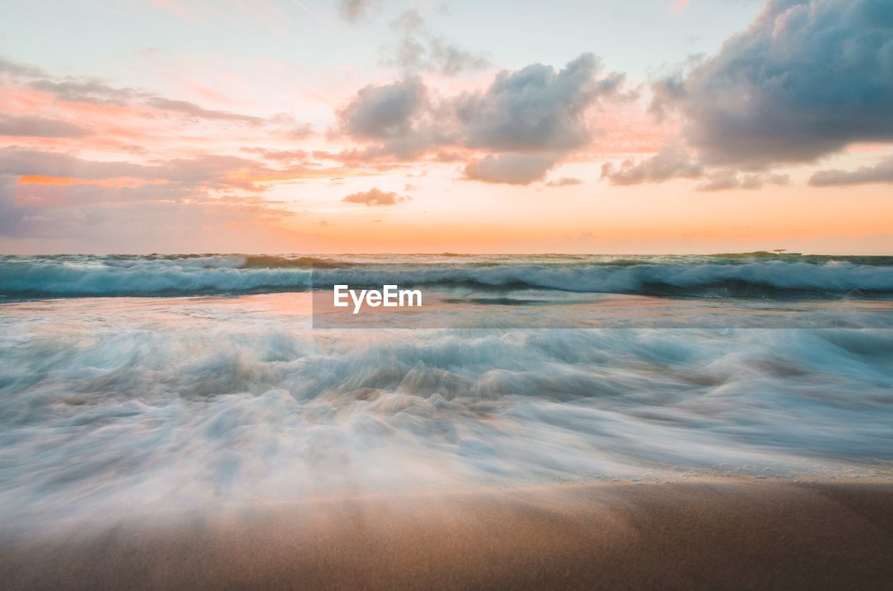 Scenic view of sea against sky during sunset