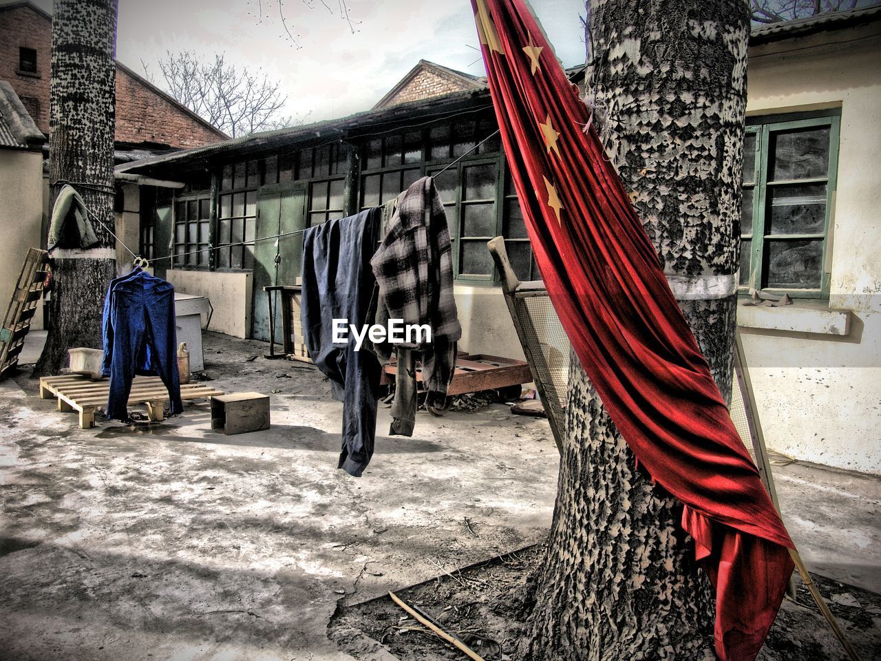 Clothes drying on clothesline outside house