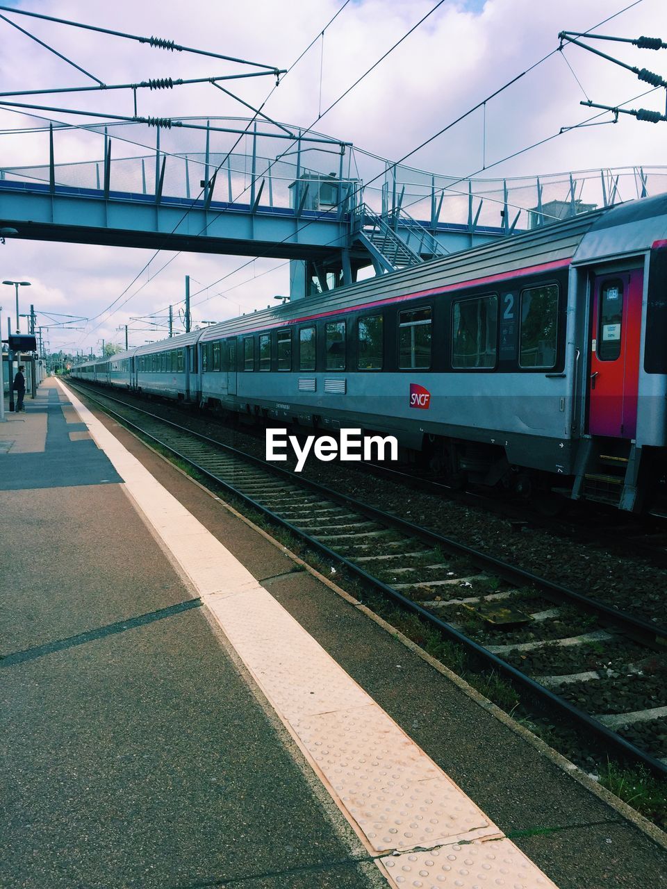 TRAIN AT RAILROAD STATION PLATFORM