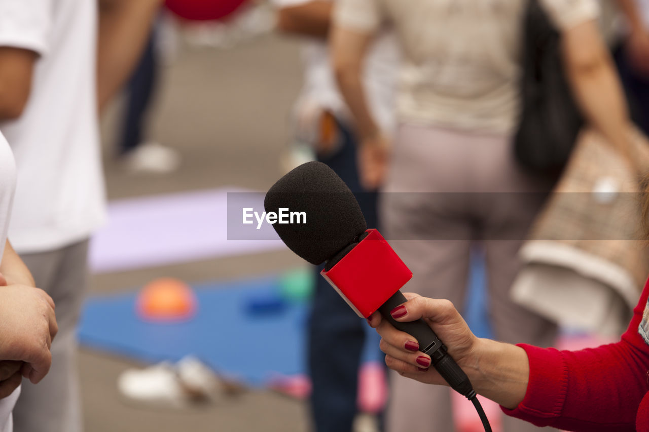 Close-up of hand holding microphone