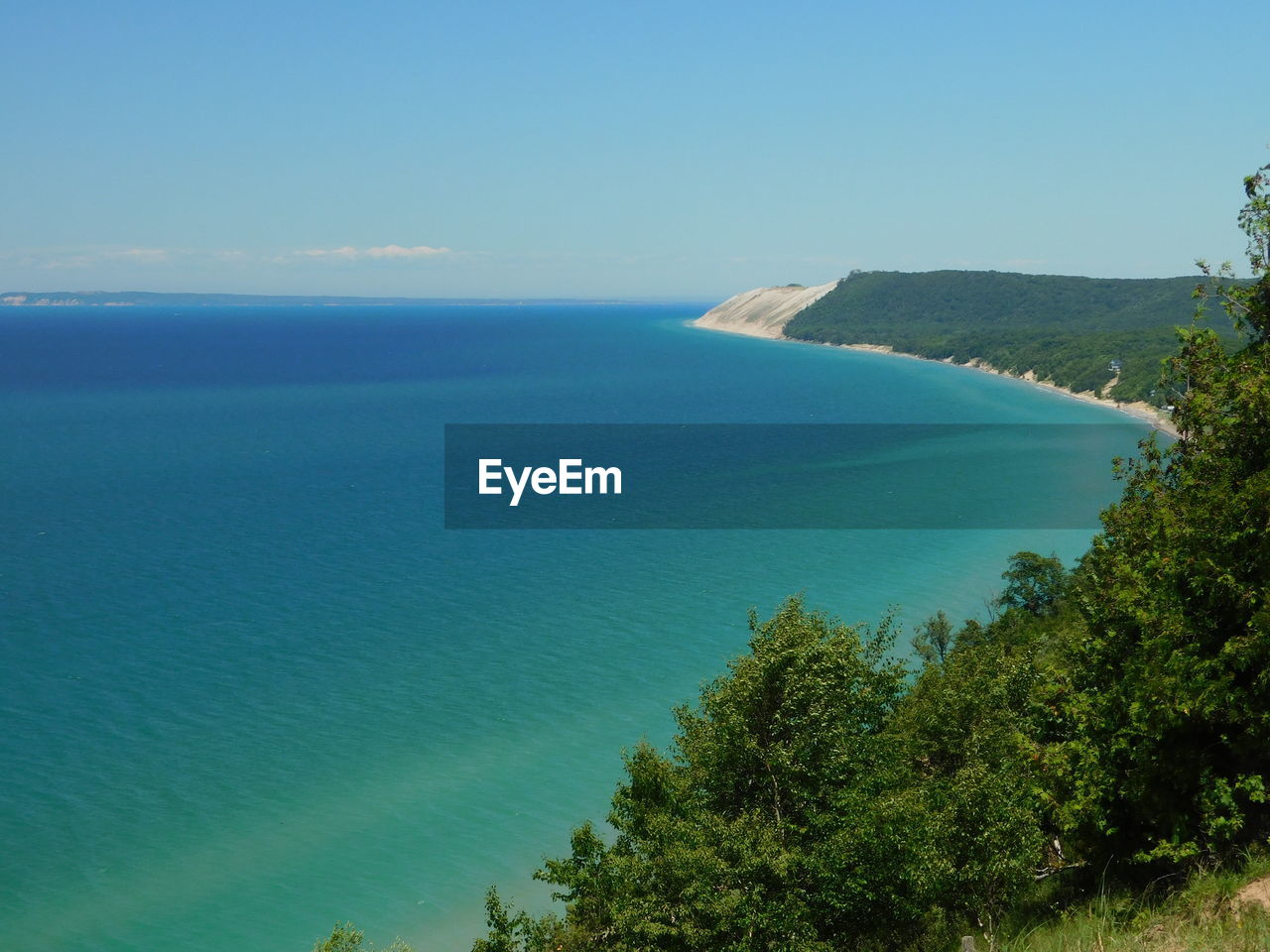 water, sea, scenics - nature, land, tree, beauty in nature, sky, plant, nature, body of water, beach, tranquility, blue, tranquil scene, horizon over water, coast, no people, travel destinations, day, environment, coastline, travel, horizon, landscape, bay, idyllic, clear sky, outdoors, non-urban scene, high angle view, island, tourism, shore, ocean, terrain, green, mountain, reservoir, turquoise colored, sunny, vacation, holiday, trip