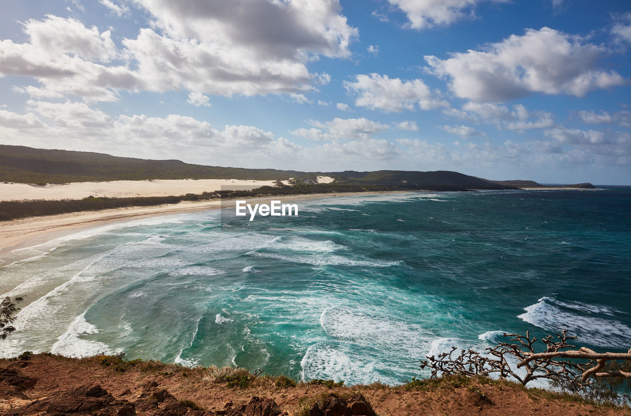 PANORAMIC VIEW OF BEACH AGAINST SKY