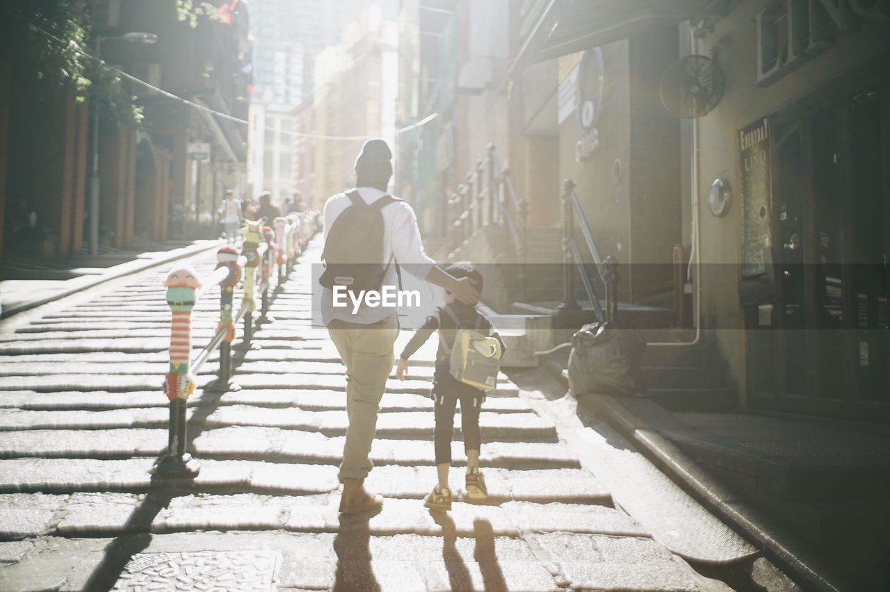 People walking on street in city