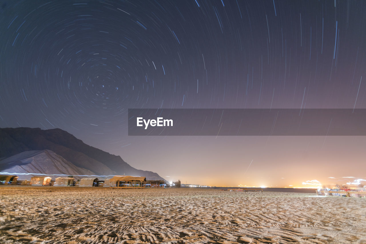 Long exposure star trail in sinai with bungalows