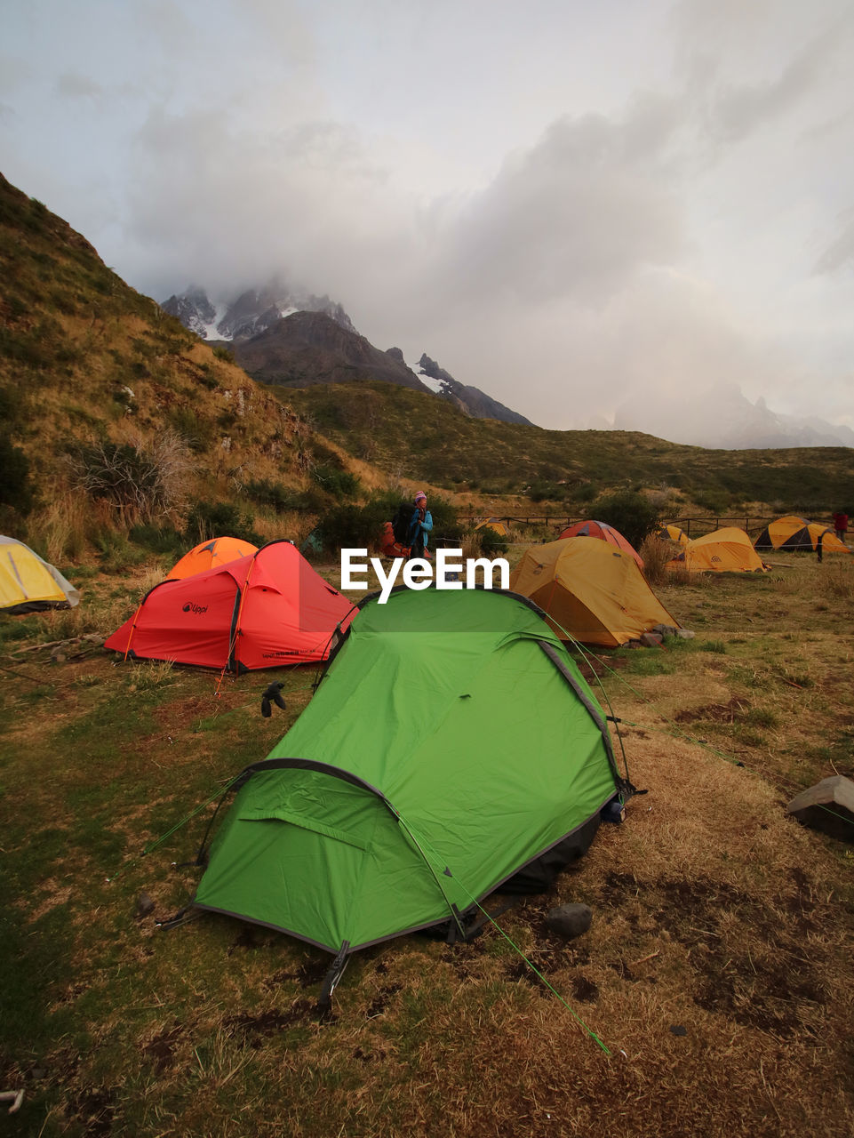 TENTS ON FIELD AGAINST SKY