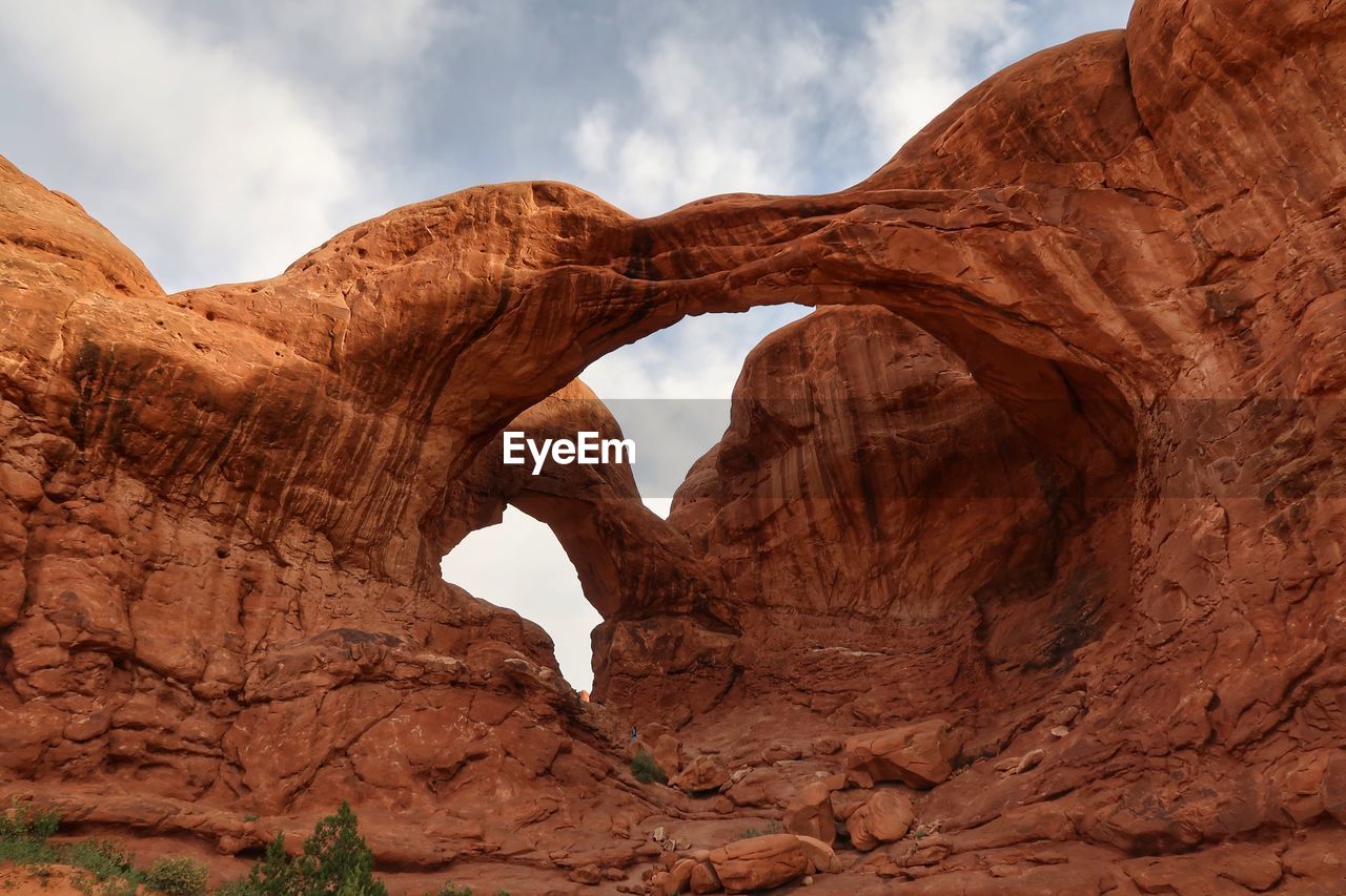 Low angle view of double arch in utah