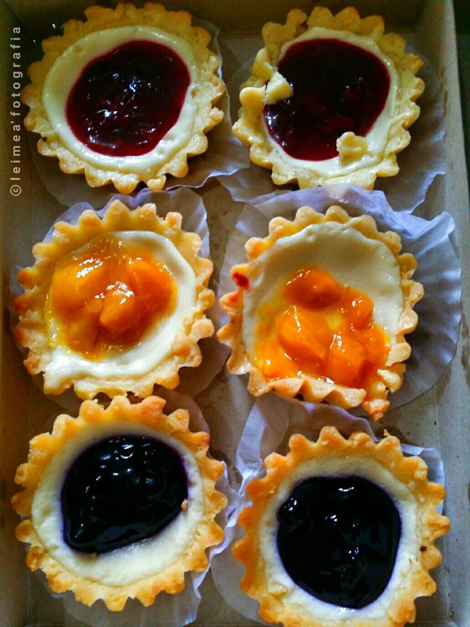 High angle view of cheese tarts in box