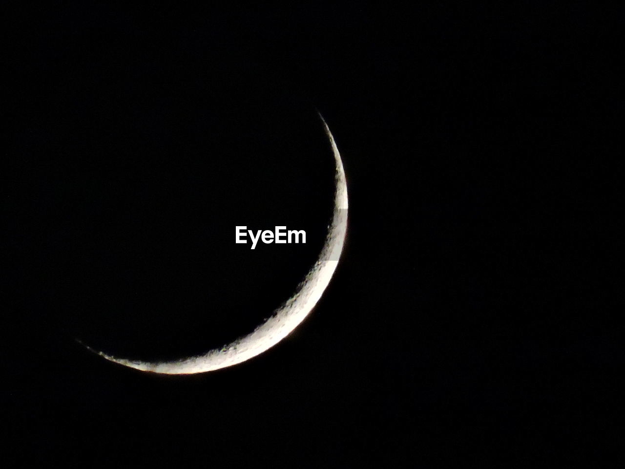 LOW ANGLE VIEW OF MOON IN SKY