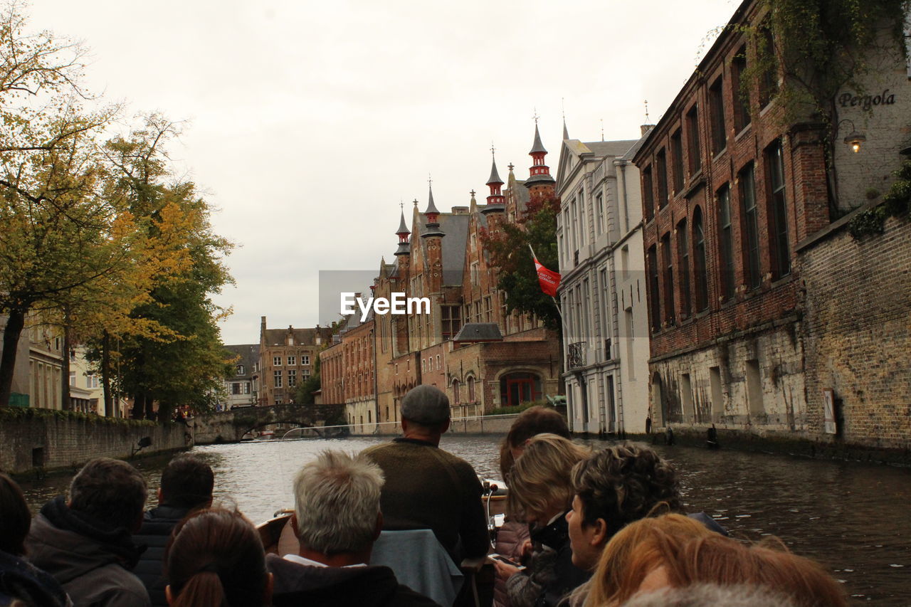 Rear view of people walking in city