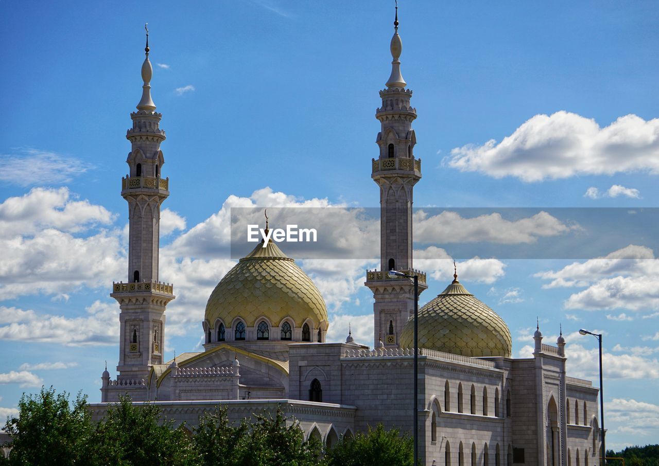 View of buildings in city against sky