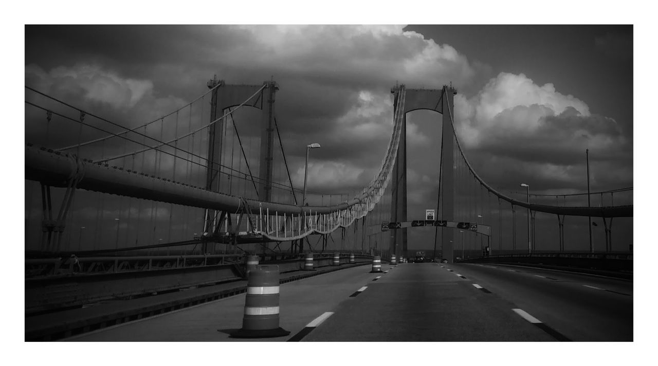 VIEW OF BRIDGE AGAINST CLOUDY SKY