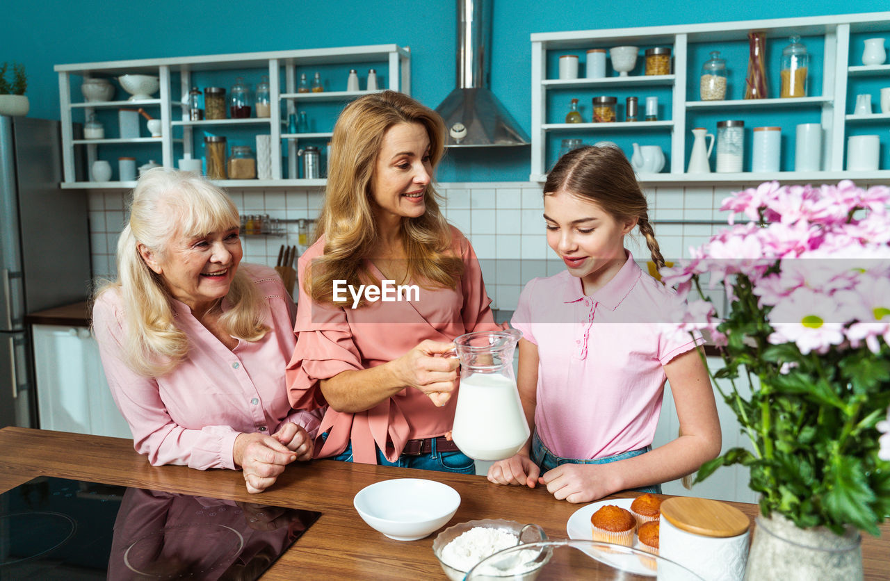 Happy family making dessert at kitchen