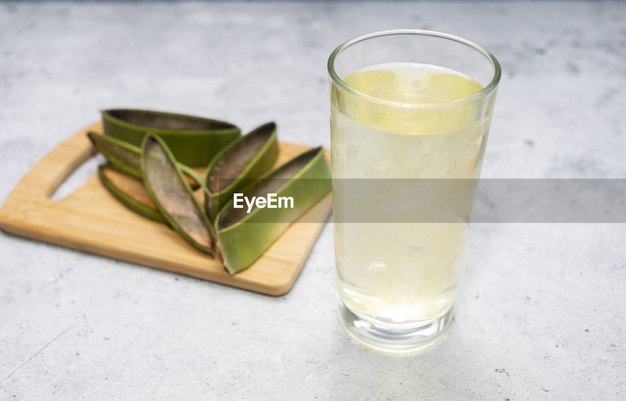 food and drink, glass, drinking glass, household equipment, food, refreshment, drink, freshness, produce, healthy eating, wellbeing, no people, indoors, fruit, alcoholic beverage, leaf, herb, studio shot, soft drink, close-up, nature, still life