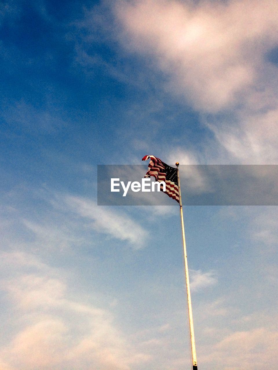 Low angle view of flag against sky