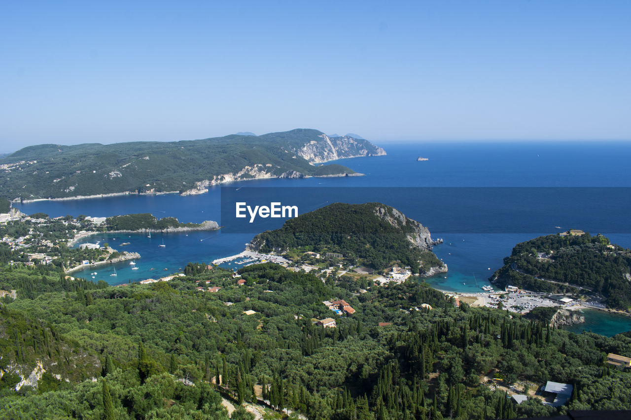 Scenic view of bay against clear sky