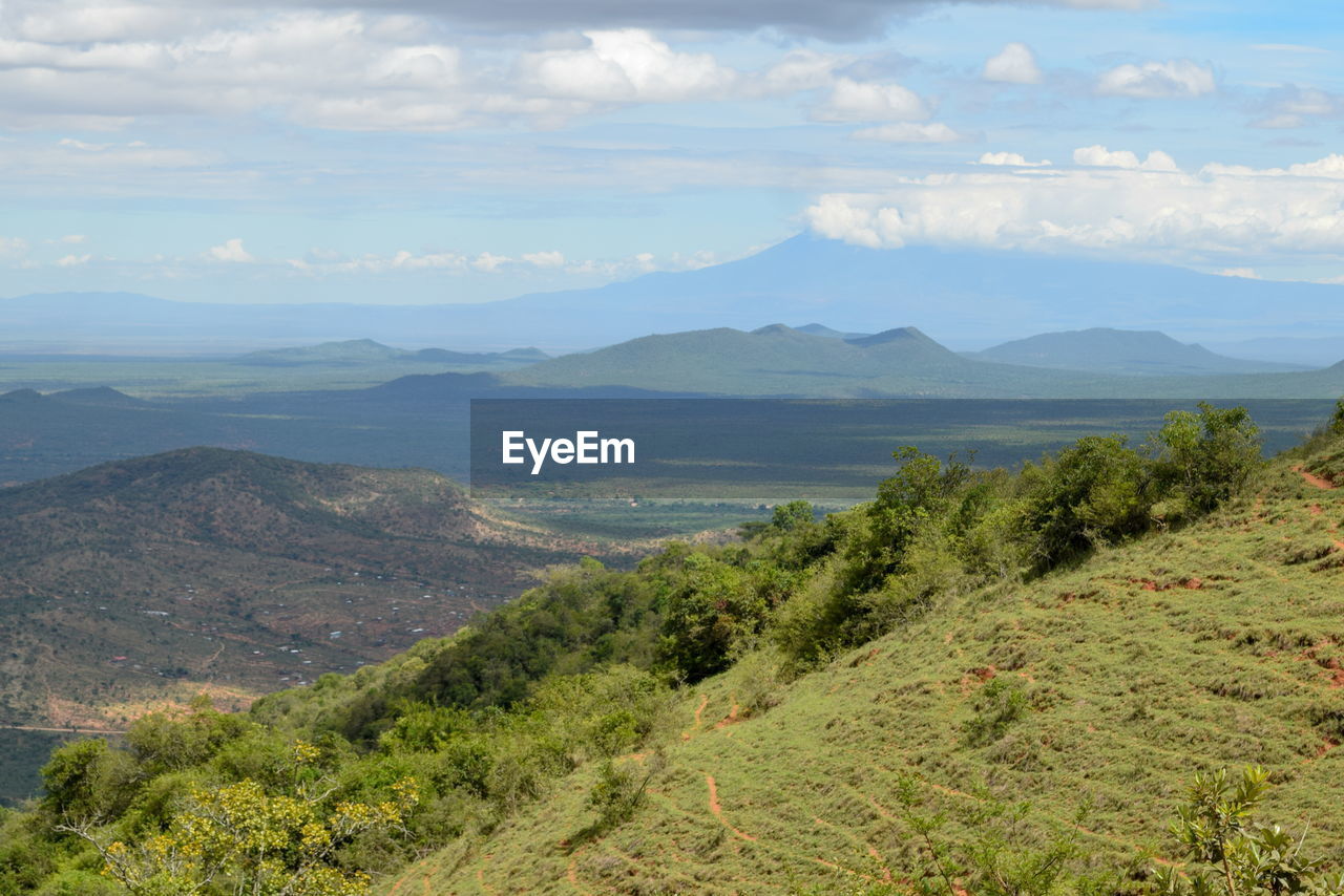 Panoramic mountain ranges in rural tanzania, mount kilimanjaro seen from namanga hills, kenya