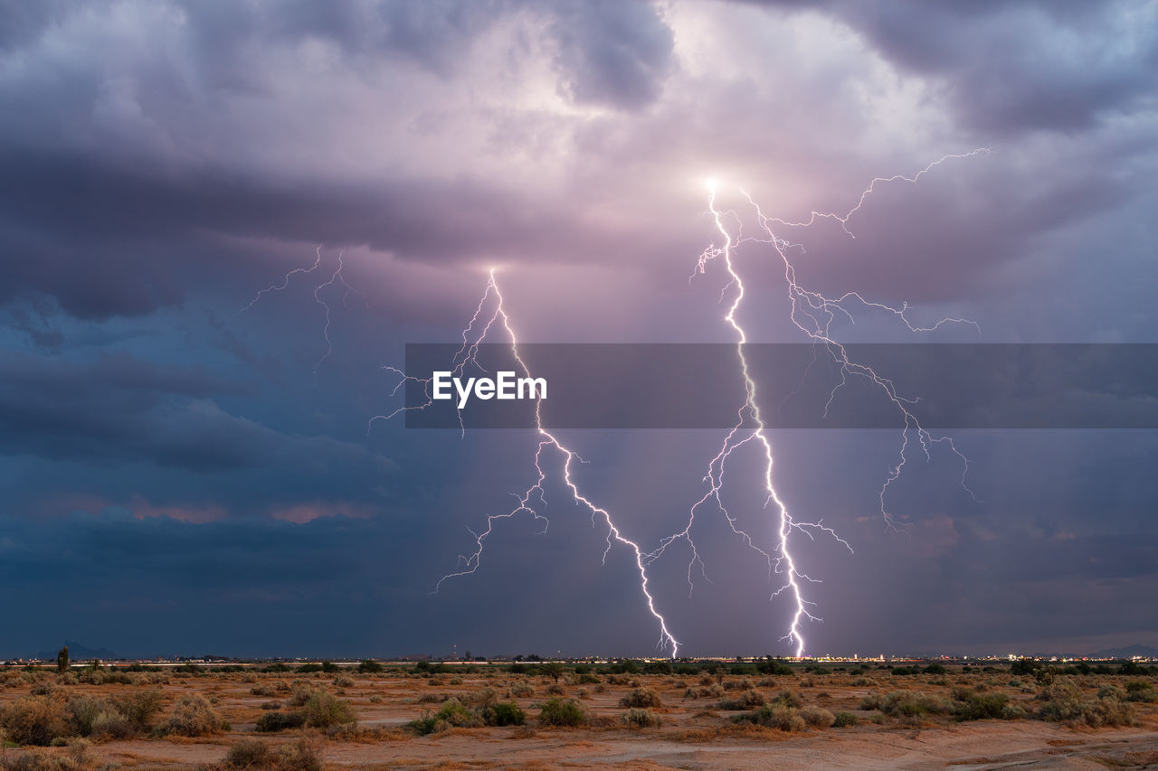 Dramatic lightning strikes in a thunderstorm over casa grande, arizona 