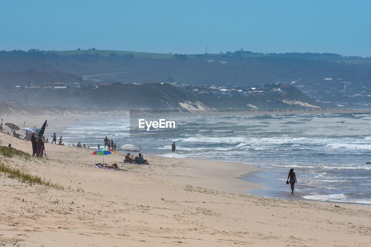 GROUP OF PEOPLE ON BEACH