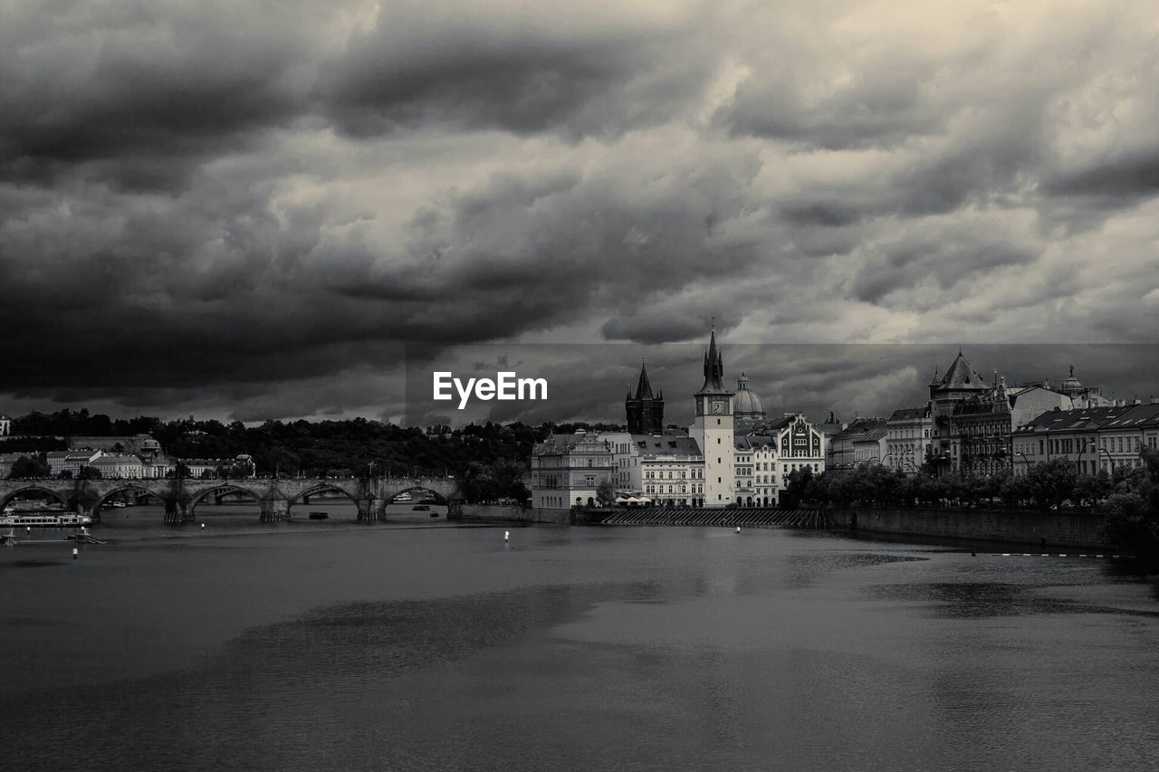 Buildings against clouds with waterfront